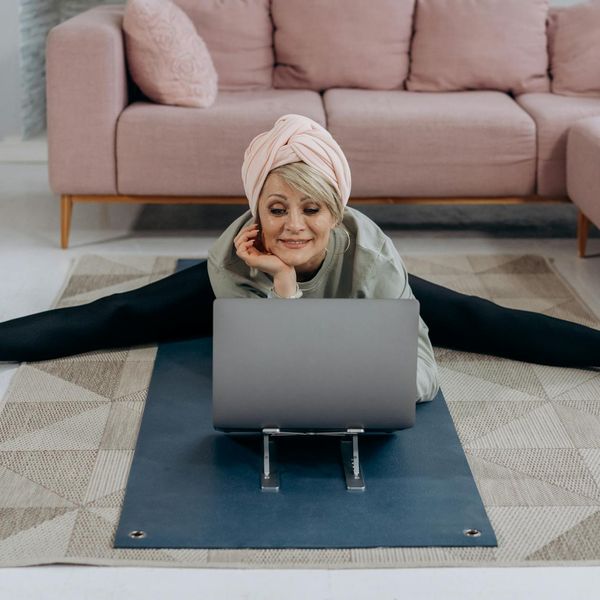Person stretching gently, demonstrating improved body flexibility and comfort.
